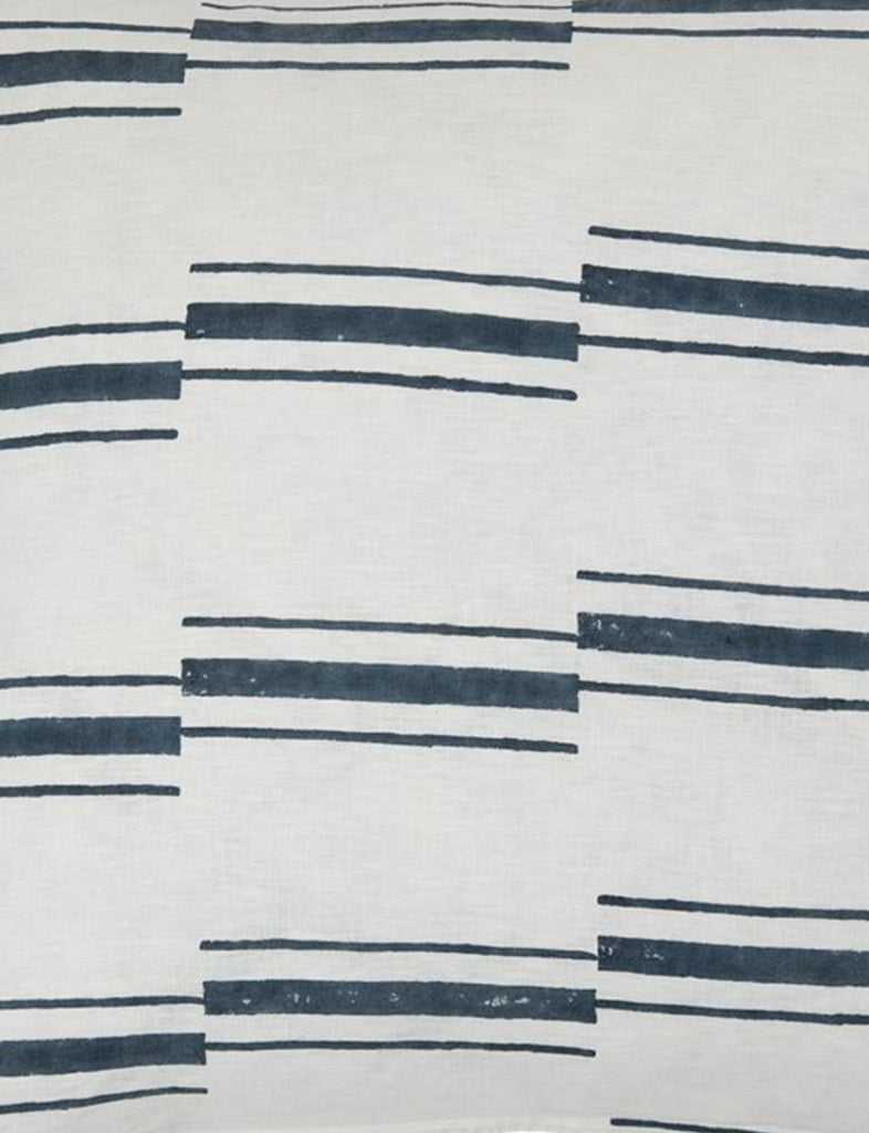 Block printed white linen pillow with a dark teal offset stripe